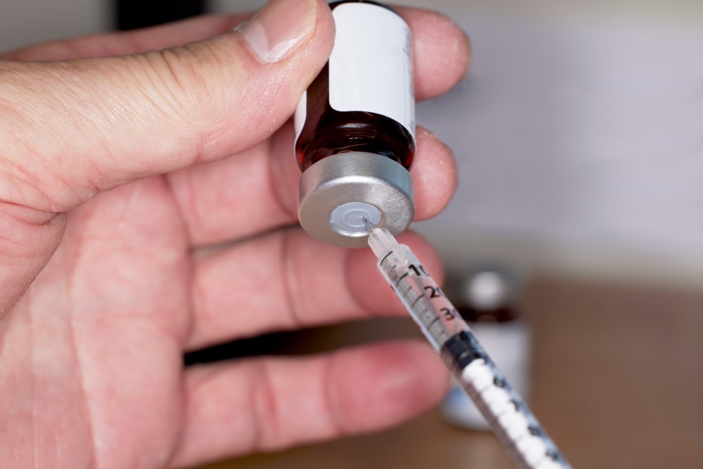 Man getting ready to inject testosterone