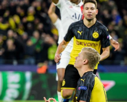 Erling Haaland of Dortmund celebrates his first goal in a yoga pose during the UEFA Champions League round of 16 first leg match between Borussia Dortmund and Paris Saint-Germain