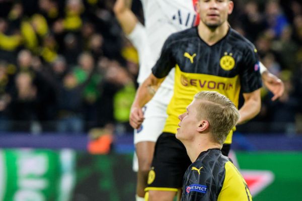 Erling Haaland of Dortmund celebrates his first goal in a yoga pose during the UEFA Champions League round of 16 first leg match between Borussia Dortmund and Paris Saint-Germain