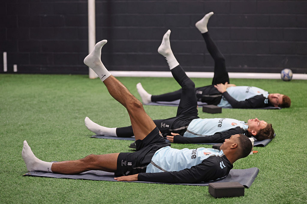 Sunderland players warm up with pilates in the gym 